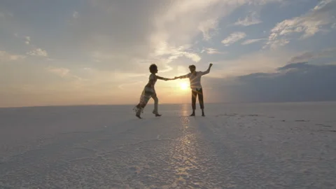 Interracial couple dancing in barren environment Video stock 270081242