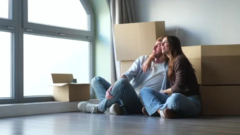 Interracial couple holding keys taking selfie in Stock Footage 332685493
