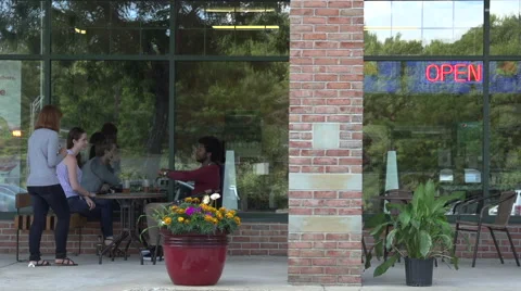 An interracial couple joke with a waitress. Stock Footage 44116434