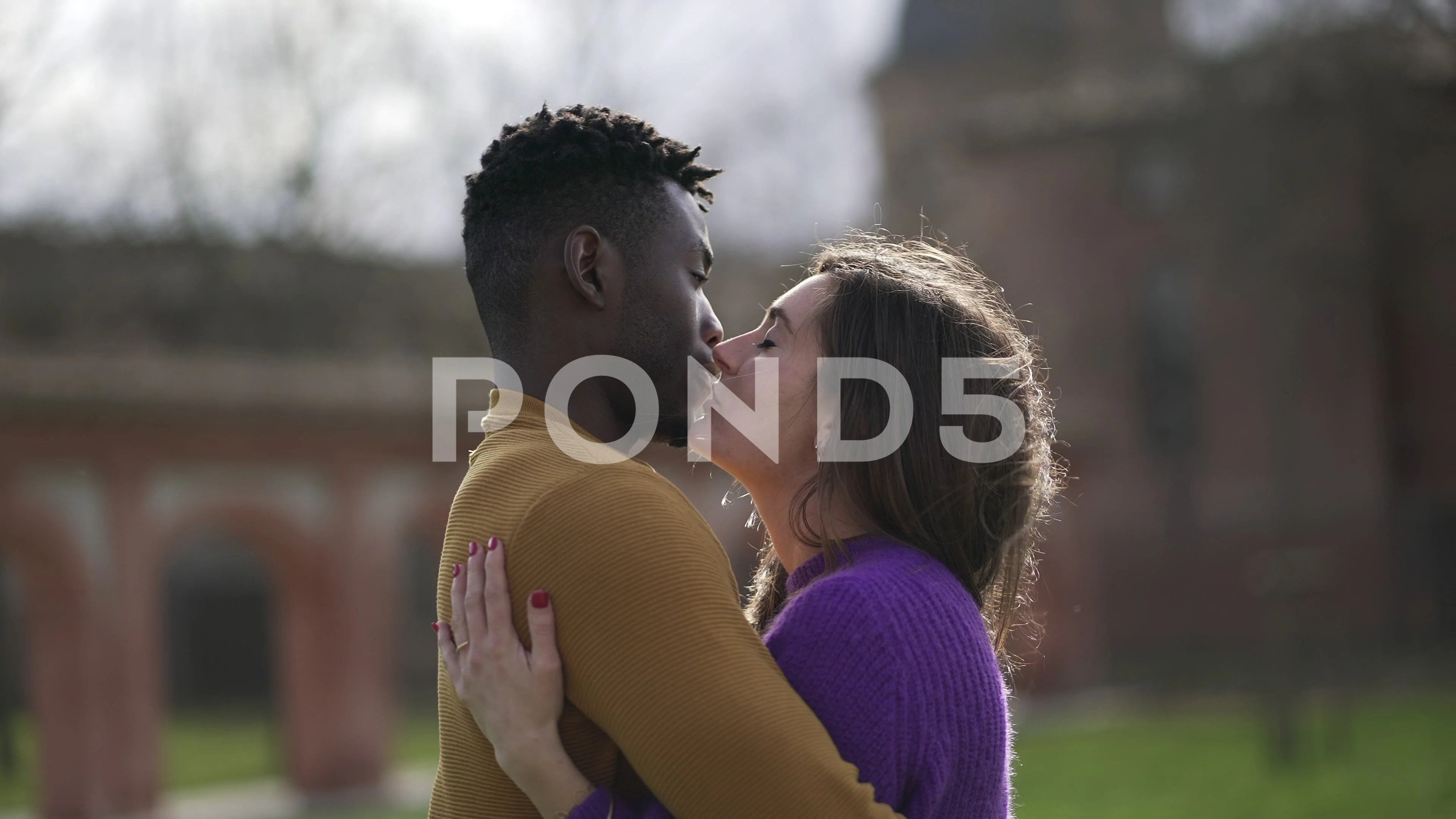 Interracial couples kissing