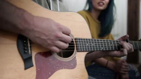 Interracial Couple Sings Together While Man Plays Guitar, Closeup Gimbal Shot Stock Footage 146047255