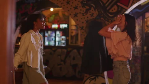 Interracial couple talking about something at a pub Stock Footage 262560764