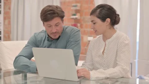 Interracial Couple Using Laptop at Home Stock Footage 238647227