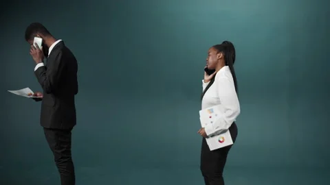 An interracial group is walking away with documents in hands, talking on the Stock Footage 170675560