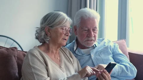 Interracial happy couple smiling at camera at home Stock Footage 332685424