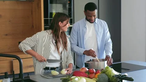 Interracial happy couple smiling at camera at home 스톡 동영상 334636415