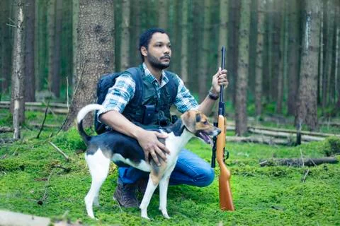Interracial hunter in the forest Stock Photos