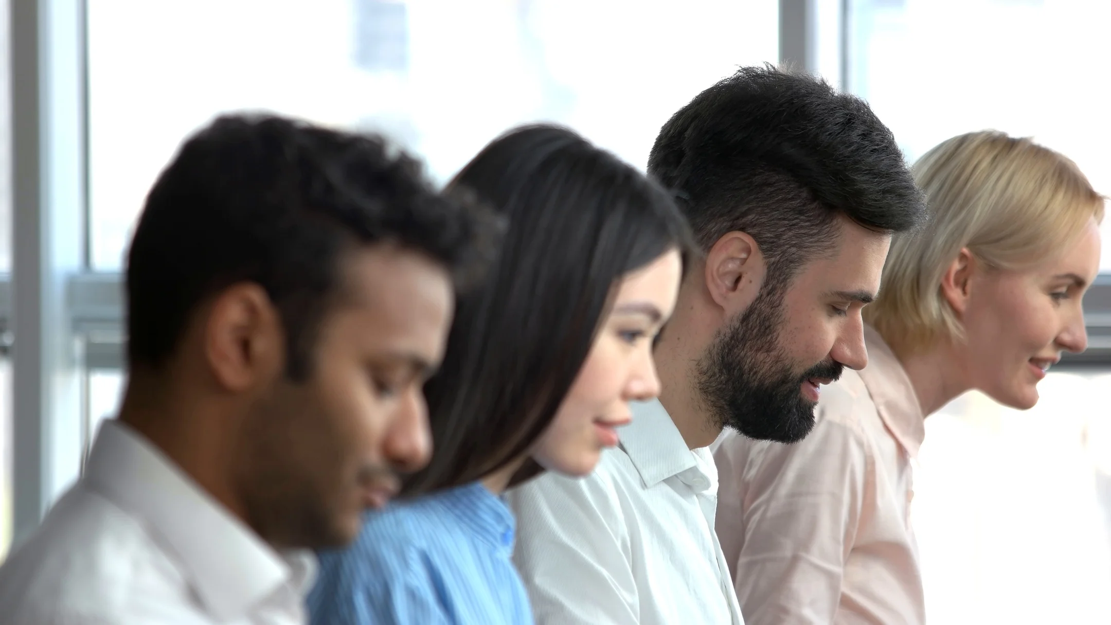 Interracial office workers faces. | Stock Video | Pond5