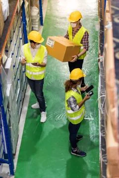Interracial warehouse workers team do inventory, Top view. Stock Photos