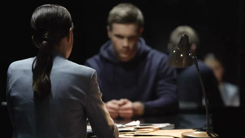 Interrogating lady pressing criminal man and he denying guilt, bad cop technique Stockbeeldmateriaal 86127181
