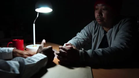 Interrogator showing a knife with fingerprints as a murder evidence Stock Footage 148339057