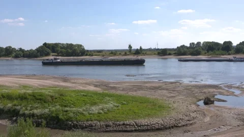 Intersecting barges, not fully loaded, low water level river Rhine Stock Footage 205465469