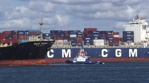 Intersecting container ships, assisted by tugboat, Port of Rotterdam Stock Footage 44418326