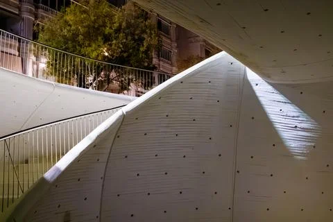 Intersecting Curved Surfaces and Urban Backdrop 스톡 사진