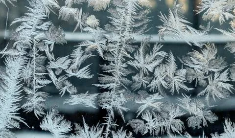 Intersecting to frost line, patterns on the window glass Stock Photos