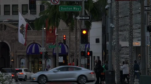 Intersecting traffic on Rodeo Drive at golden hour, Beverly Hills California Stock Footage 124180198