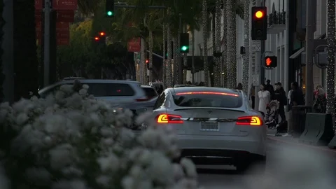 Intersecting traffic on Rodeo Drive at Golden Hour, Beverly Hills California Stock Footage 124180537
