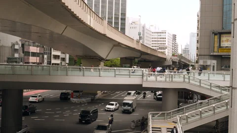 Intersection and pedestrian bridge under Shibuya overpass. Tokyo, Japan. 스톡 동영상 246410278