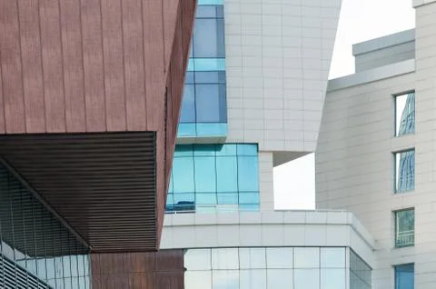 Intersection of buildings of different shapes and colors. Stock Photos