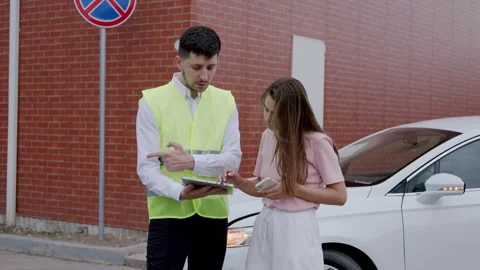 At an intersection, a car hit a scooter. The driver called the car insurance Stock Footage 248528126