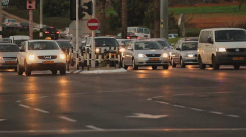 Intersection cars starting to drive evening Stock Footage 30210868