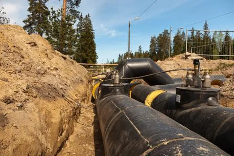 Intersection of district heating pipes Stock Photos