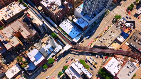 Intersection with elevated train tracks and urban traffic, Chicago, Illinois Stock Footage 343850380