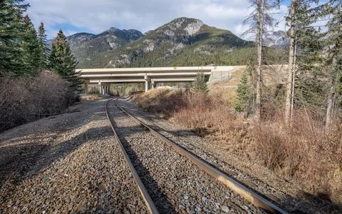 Intersection of Highway and Train Tracks 스톡 사진