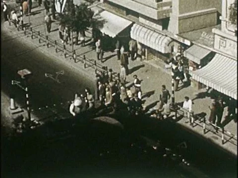 An intersection in Jerusalem and workers constructing a new building for a high Stock Footage