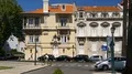 Intersection with little traffic in front of beautifully designed old buildings HD Footage