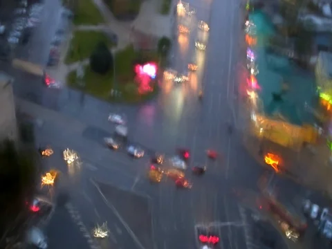 The intersection with the machines through a wet window in the rain Stock Footage 81309924