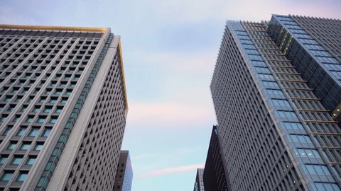 Intersection at Main Road in Ginza Business District With Office Buildings On Vidéo 105053764