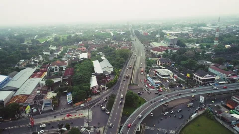 Intersection main road in Yogyakarta city with flyover junction and bridge Stock Footage 155304299