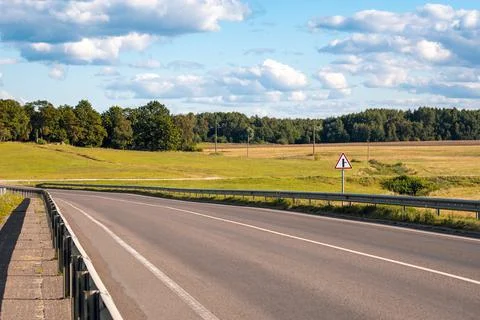 Intersection with minor side-road on the right sign Stock Photos