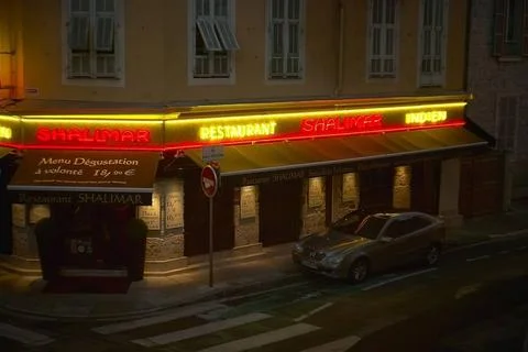  Intersection of the nice suburbs during the night lit by red lights and n... Stock Photos