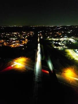 Intersection at night with light trails Stock Photos