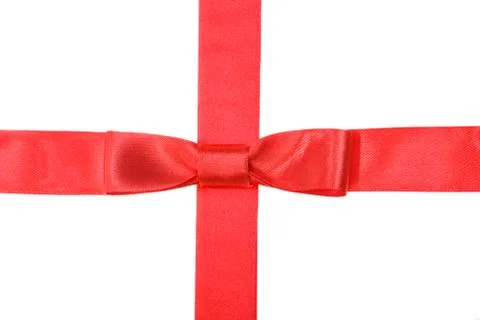 Intersection of red ribbon and red tape with bow Fotos de archivo