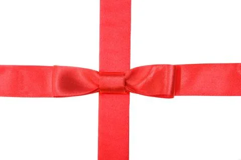 Intersection of red ribbon and red tape with bow intersection of red satin... Fotos de archivo