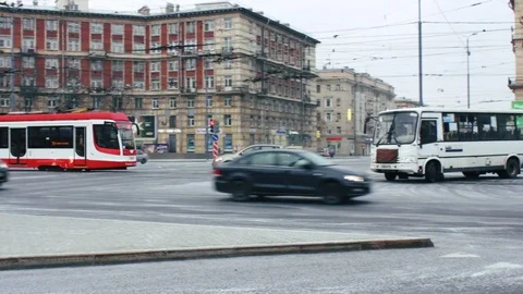 The intersection of St.-Petersburg passes the red tram Stock Footage 104260861