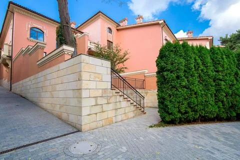 The intersection of streets on the corner of the old town house with stone. Stock Photos
