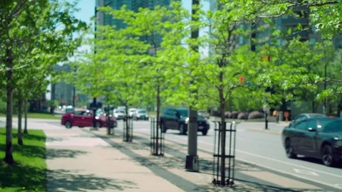Intersection traffic on a busy four lane city street. Stock Footage 76267330