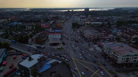 Intersection traffic flowing at Port Klang downtown. Majestic aerial view drone Stock Footage 336287502