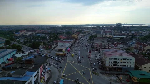 Intersection traffic flowing at Port Klang downtown. Perfect aerial view drone Video stock 336364660