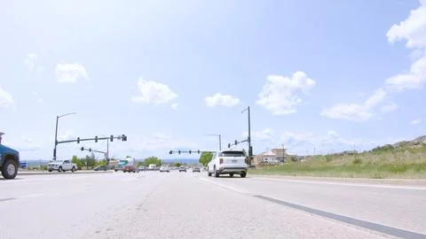 Intersection with traffic lights and vehicles Stock Photos