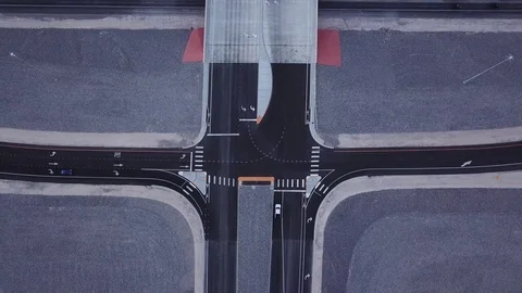 Intersection zooming out aerial 4-way stop Stock Footage 81575017