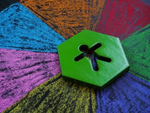 Intersectionality concept. The figurine lies on multi-colored segments. Stock-Fotos