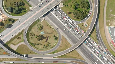Intersections in metropolis. Traffic on highway at summer. Real speed. Top view. Stock Footage 140012505