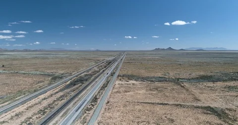 Interstate 10 with vehicles driving at speed in the desert drone aerial 4K Stock Footage 111314211