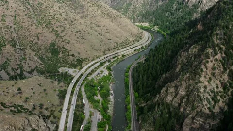 Interstate 70 running parallel to the Colorado River in Glenwood Canyon. Video stock 316760201