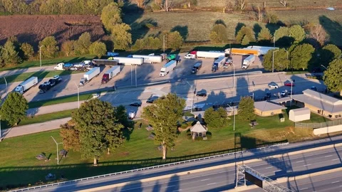 Interstate 75 rest stop with trucks and cars providing travel services in Stock Footage 327852610